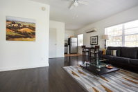 Clean cosy flat steps from the beach Tourism Bookings